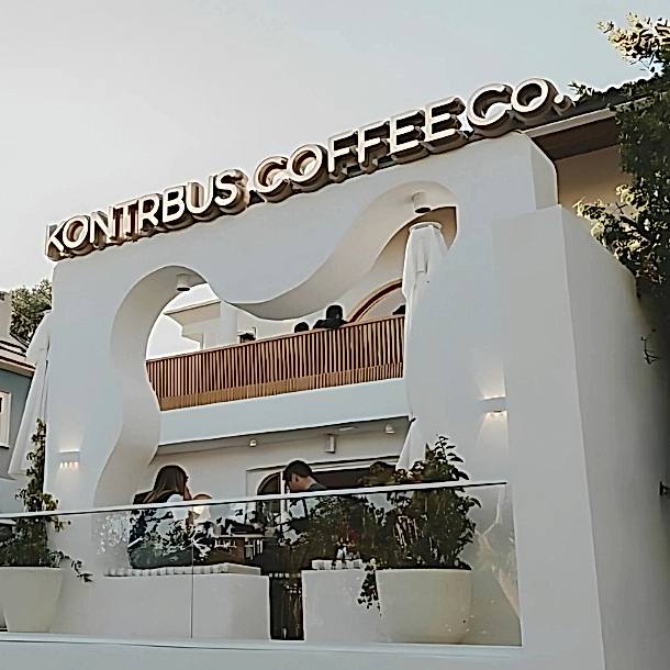 Barista Pours Water From Coffee Pot